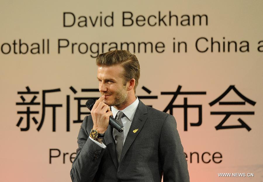British footballer David Beckham reacts during a press conference in Beijing, capital of China, on March 20, 2013. David Beckham came to China as the ambassador for the youth football Program in China and the Chinese Super League (CSL). (Xinhua/Cao Can) 