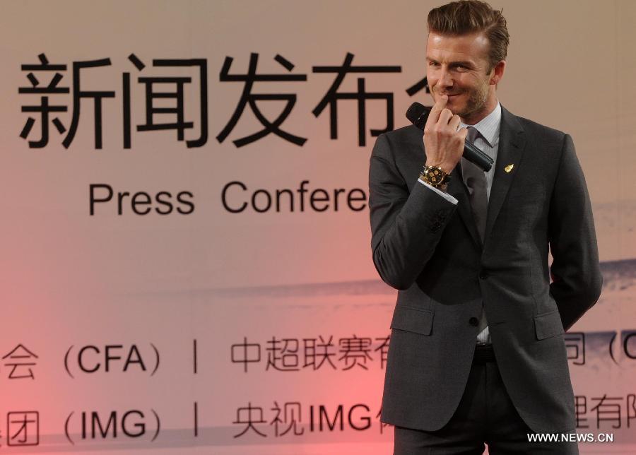 British footballer David Beckham reacts during a press conference in Beijing, capital of China, on March 20, 2013. David Beckham came to China as the ambassador for the youth football Program in China and the Chinese Super League (CSL). (Xinhua/Gong Lei) 
