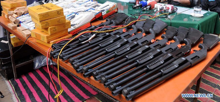 Picture taken on March 19, 2013 shows seized weapons at a police station in northwest Pakistan's Peshawar. Police arrested two suspects who tried to smuggle weapons and ammunitions from Peshawar to Punjab province, local media reported. (Xinhua/Ahmad Sidique) 