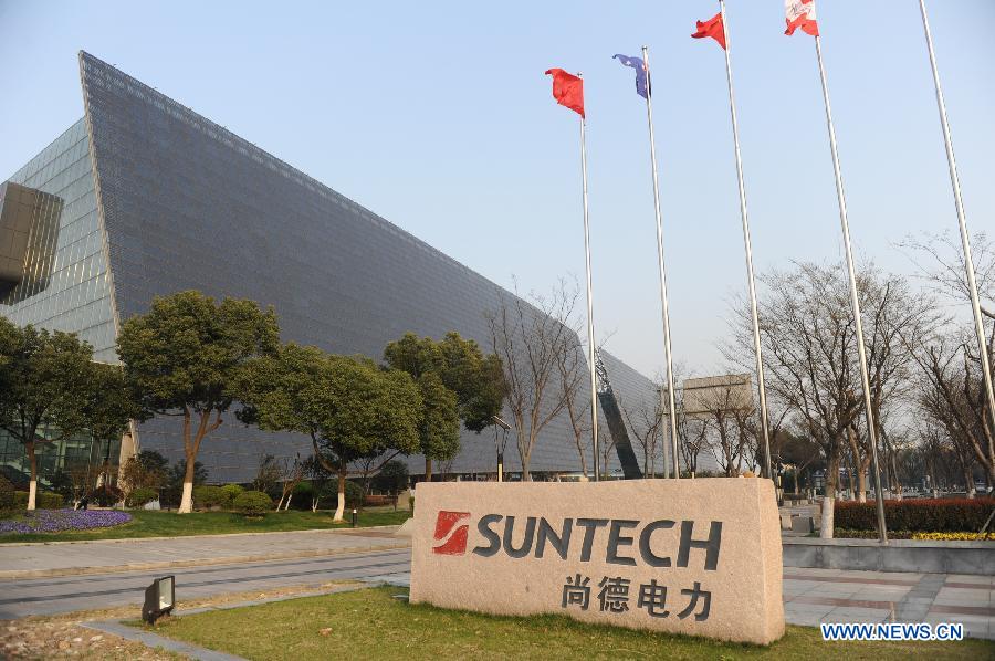 Photo taken on March 17, 2013 shows a solar-panel-covered building at the Suntech Power headquarters in Wuxi, east China's Jiangsu Province. China's leading solar panel maker Suntech Power, a New York-listed private company based in Wuxi, declared bankruptcy on Wednesday. (Xinhua/Shen Peng) 