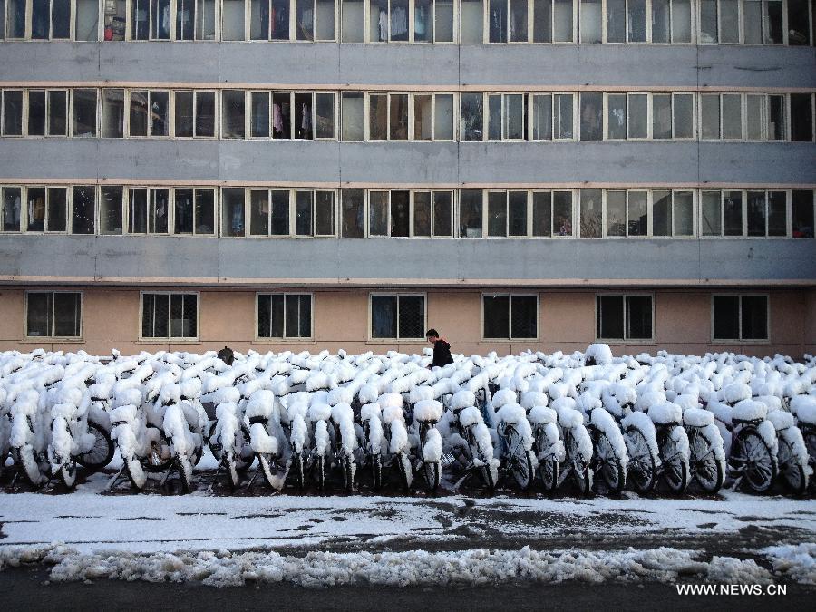 Photo taken on March 20, 2013 with a cell phone shows bicycles covered with snow on the campus of Beijing Jiaotong University in Beijing, capital of China. Beijing witnessed a snowfall with a depth reaching 10-17 centimeters overnight. The snowfall happened to hit the city on the Chinese traditional calendar date of Chunfen, which heralds the beginning of the spring season. Chunfen, which literally means Spring Equinox or Vernal Equinox, falls on the day when the sun is exactly at the celestial latitude of zero degrees. (Xinhua/Pan Chaoyue)