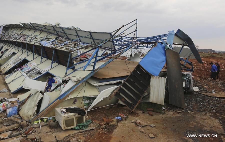 A collapsed shed is seen in Daoxian County, central China's Hunan Province, March 20, 2013. Three people were killed and 52 others were injured by a tornado that struck the county before dawn on Wednesday. The local meteorological observatory said the wind speed of the tornado reached 30.7 meters per second, a record for the observatory. (Xinhua/Guo Guoquan)