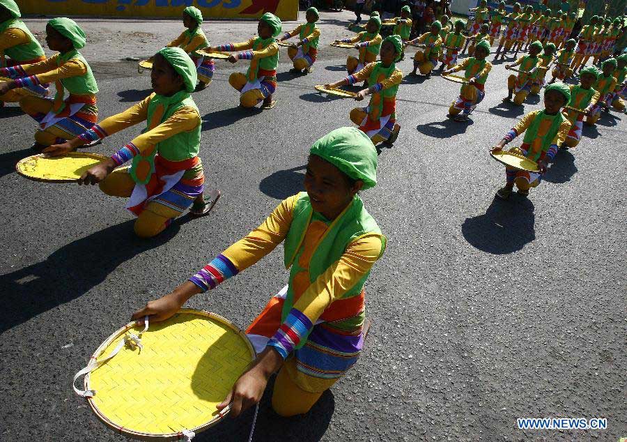 Dancers perform on a street during the Mango Festival in Zambales Province, the Philippines, March 20, 2013. The Mango Festival is held in Zambales annually to promote mango as the local signiture with colorful floats and street dances. (Xinhua/Rouelle Umali)
