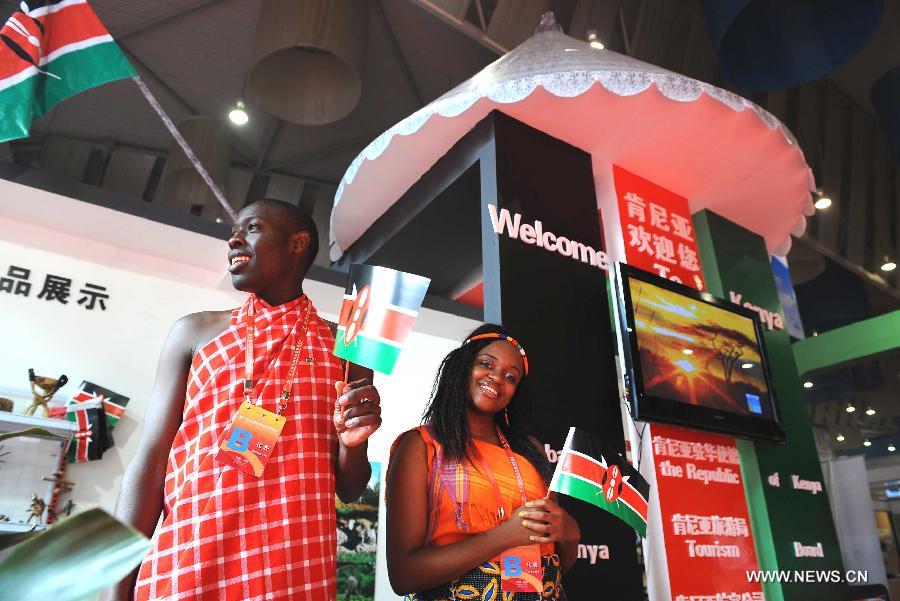 Kenyan delegates take part in the Western China International Economy and Trade Fair in Chengdu, capital of southwest China's Sichuan Province, Oct. 16, 2009. China-Africa economic and trade cooperation is mutually beneficial, strongly boosting the common development of the two sides. Chinese President Xi Jinping will visit Tanzania, South Africa and the Republic of Congo later this month and attend the fifth BRICS summit on March 26-27 in Durban, South Africa. (Xinhua/Chen Xie) 