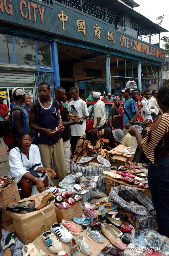 Vendors sell Chinese goods at a Chinese market in Douala, Cameroon, Dec. 1, 2005. China-Africa economic and trade cooperation is mutually beneficial, strongly boosting the common development of the two sides. Chinese President Xi Jinping will visit Tanzania, South Africa and the Republic of Congo later this month and attend the fifth BRICS summit on March 26-27 in Durban, South Africa. (Xinhua/Yang Lei) 