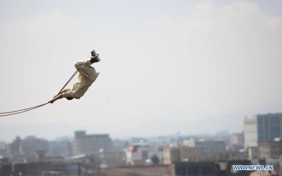 An Afghan child enjoys the swing during the celebration of Nowruz festival in Kabul, Afghanistan, March 21, 2013. Afghans celebrate the Nowruz festival as the first day of the year in Persian calendar. (Xinhua/Ahmad Massoud)