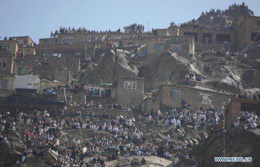 Afghan people gather on the hillside during the celebration of Nowruz festival in Kabul, Afghanistan, March 21, 2013. Afghans celebrate the Nowruz festival as the first day of the year in Persian calendar. (Xinhua/Ahmad Massoud)