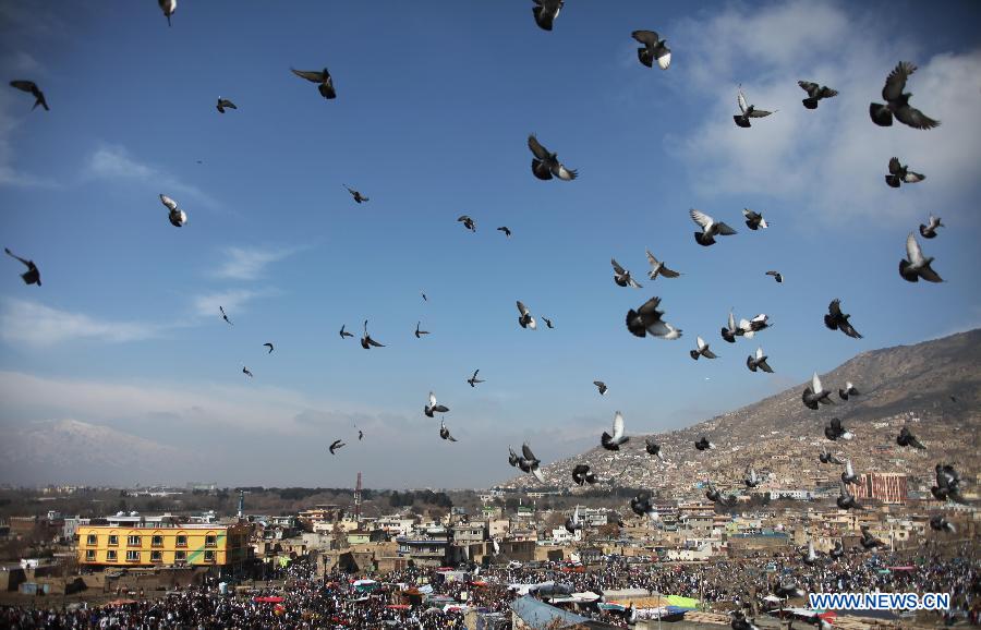Pigeons fly over the sky during the celebration of Nowruz festival in Kabul, Afghanistan, March 21, 2013. Afghans celebrate the Nowruz festival as the first day of the year in Persian calendar. (Xinhua/Ahmad Massoud)