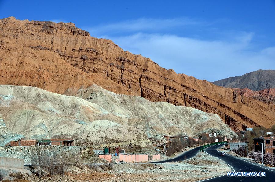 Photo taken on March 21, 2013 shows a scenic view of the Danxia Landform in Guide County of the Hainan Tibet Autonomous Prefecture, northwest China's Qinghai Province. Danxia is a special landform from reddish sandstone that has been eroded over time into a series of mountains surrounded by curvaceous cliffs and many unusual rock formations. (Xinhua/Wang Bo)