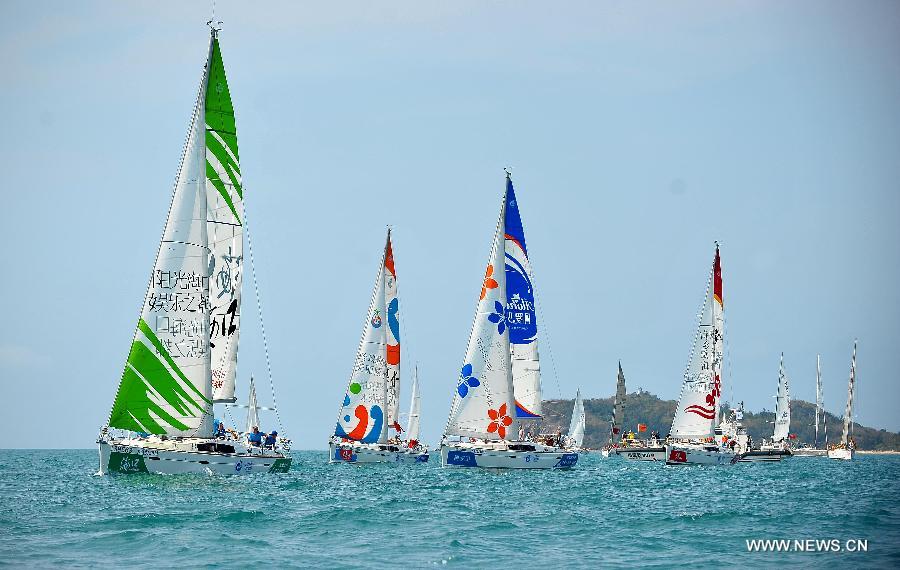 The sailing boats compete during the second day of racing at the 2013 Round Hainan International Regatta in Sanya, capital of south China's Hainan Province, March 22, 2013. (Xinhua/Guo Cheng)