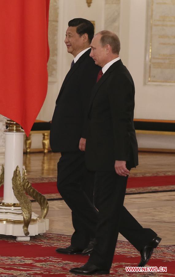 Chinese President Xi Jinping (L) is welcomed by Russian President Vladimir Putin at the Kremlin Palace in Moscow, capital of Russia, March 22, 2013. Chinese President Xi Jinping arrived in Moscow Friday for a state visit to Russia. (Xinhua/Lan Hongguang)