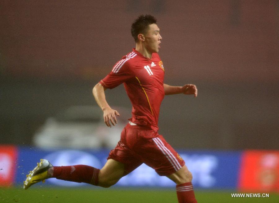 Yu Dabao of China celebrates after scoring during the 2015 AFC Asian Cup qualifier football match between China and Iraq in Changsha, capital of central China's Hunan Province, March 22, 2013. China won 1-0. (Xinhua/Guo Yong)