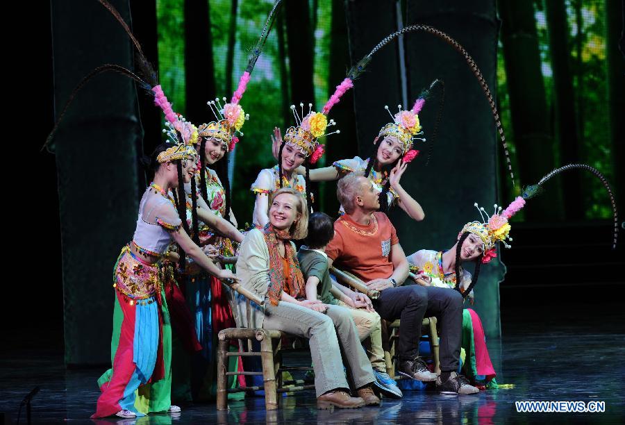 Artists perform during the opening ceremony of the "Tourism Year of China" in Moscow, March 22, 2013. The "China-Russia Tourism Year" program, which began last year with the "Tourism Year of Russia" in China, aims to foster tourism ties and humanistic exchanges between the two countries. (Xinhua/Jiang Kehong)