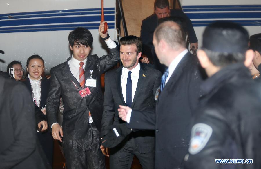 Football superstar David Beckham receives warm welcome as he arrives in Wuhan, capital of central China's Hubei Province, as the ambassador for the Chinese Super League (CSL) and the Youth Football Program, March 22, 2013. (Xinhua) 