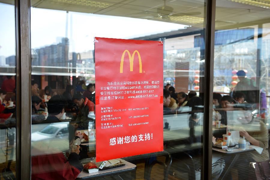 A closure notice is seen on a window of the McDonald's restaurant at Chang'an Market in Beijing, capital of China, March 24, 2013. Opened in 1993 as the second outlet of the American fast-food giant in Beijing, the Chang'an Market McDonald's made indelible impressions on locals. Due to reconstruction and adjustment of the market, the outlet discontinued its business Sunday. (Xinhua/Li Xin)
