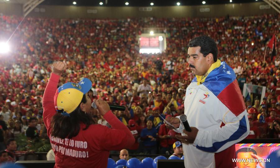 Image provided by Command Campaign Hugo Chavez shows Venezuela's Acting President Nicolas Maduro (R) attending a rally in Lara State, Venezuela, on March 24, 2013. (Xinhua/Command Campaign Hugo Chavez)