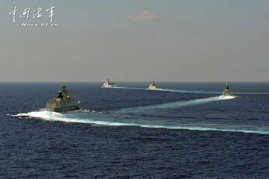 The picture shows the "Jinggangshan" amphibious dock landing ship, the "Lanzhou" guided missile destroyer, the "Yulin" guided missile frigate and the "Hengshui" guided missile frigate of the combat-readiness patrol and high-sea training taskforce under the South China Sea Fleet of the Navy of the Chinese People's Liberation Army (PLA) conducts training on the subject of battle-order deploying in the waters of the South China Sea on March 22, 2013. (PLA Daily/Qian Xiaohu Gao Yi and Gan Jun)