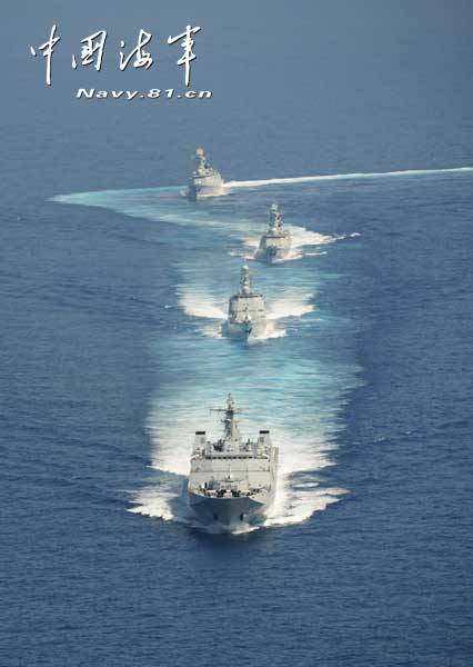 The picture shows the "Jinggangshan" amphibious dock landing ship, the "Lanzhou" guided missile destroyer, the "Yulin" guided missile frigate and the "Hengshui" guided missile frigate of the combat-readiness patrol and high-sea training taskforce under the South China Sea Fleet of the Navy of the Chinese People's Liberation Army (PLA) conducts training on the subject of battle-order deploying in the waters of the South China Sea on March 22, 2013. (PLA Daily/Qian Xiaohu Gao Yi and Gan Jun)