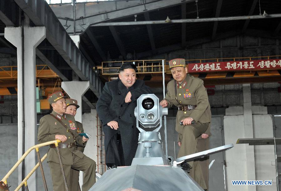 Photo provided by Korean Central News Agency (KCNA) on March 25, 2013 shows Kim Jong Un (C), top leader of the Democratic People's Republic of Korea (DPRK), inspecting People's Army Unit 1501. (Xinhua/KCNA) 
