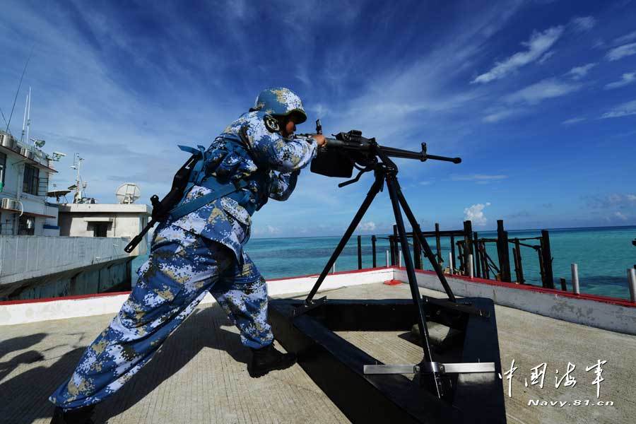 A joint maneuver taskforce under the South Sea Fleet of the Navy of the Chinese People’s Liberation Army (PLA), including the Jinggangshan amphibious dock landing ship and the Yulin guided missile frigate cruised the islands garrisoned by the troops of the South Sea Fleet in the waters of the South China Sea on March 23, 2013. (navy.81.cn/Qian Xiaohu, Song Xin)