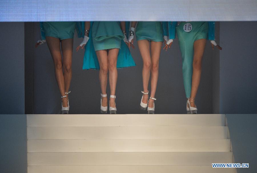 A model presents a creation of designers attending the 21st China International Young Fashion Designers Contest in Beijing, capital of China, March 25, 2013. The contest theming Boundary has attracted 29 designers from 16 countries. (Xinhua/Li Xin)