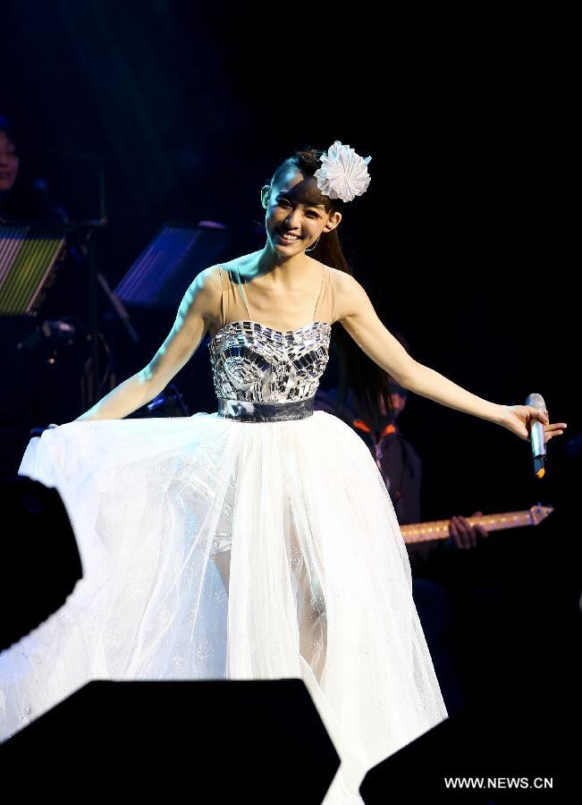 Singer Christine Fan performs during one of her world tour concerts at the O2 Indigo in London, capital of Britain, March 26, 2013. (Xinhua/Tang Shi)  