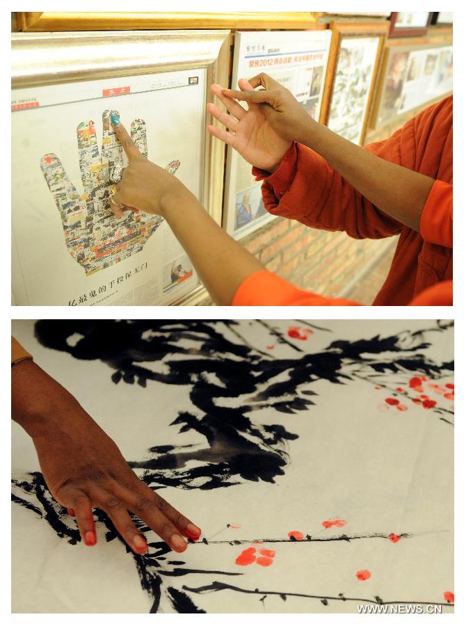 The combined photo shows Aida Yang introduces works to guests (above, taken on March 7, 2013) and she creates a Chinese painting (below, taken on Jan. 24, 2013) in her studio in Beijing, capital of China.(Xinhua/Zhang Ruiqi) 