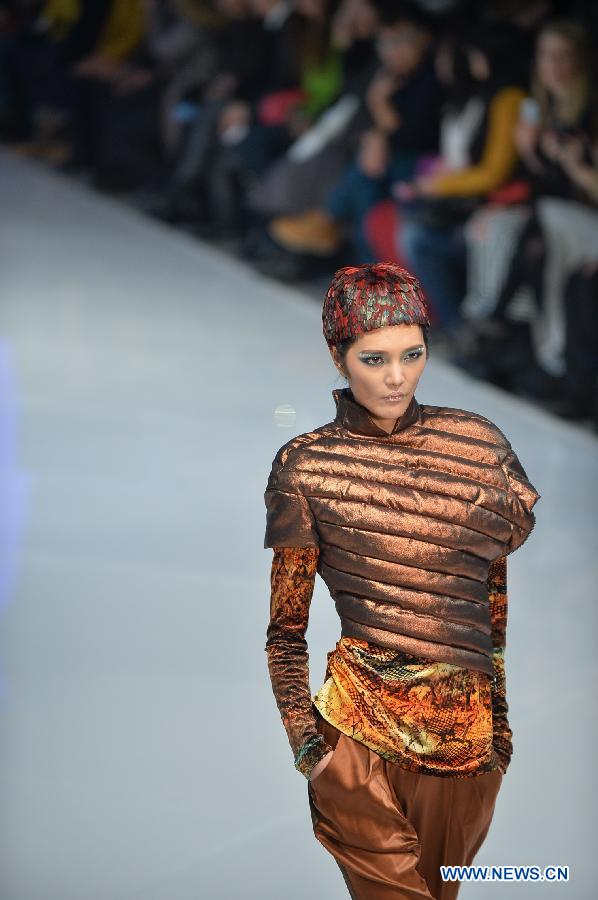 A model shows a creation during the BOSIDENG Down Wear Collection show of the 2013 China Fashion Week in Beijing, capital of China, March 26, 2013. (Xinhua/Li Xin) 