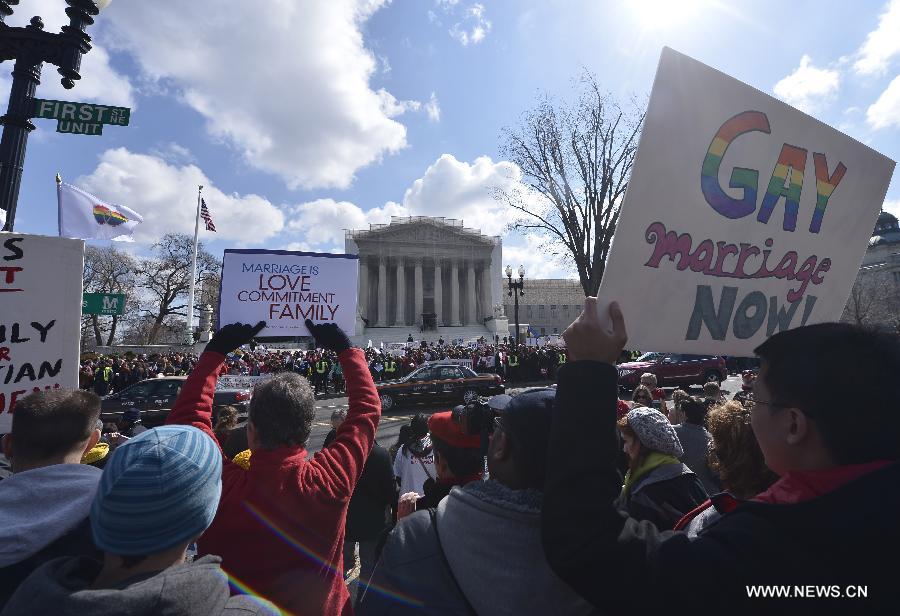Supporters and opponents of same-sex marriage rally outside the U.S. Supreme Court in Washington D.C., capital of the United States, March 26, 2013. U.S. Supreme Court on Tuesday heard arguments of California's ban on same-sex marriage, opening two days of monumental proceedings on the issue. (Xinhua/Zhang Jun) 
