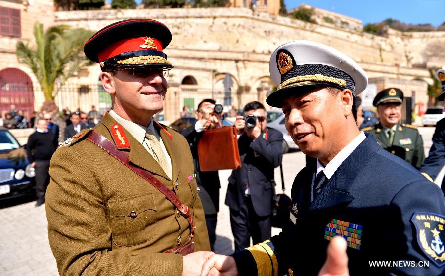 Li Xiaoyan (R), commander of the 13th Escort Taskforce of the Chinese Navy, shakes hands with Martin Xuereb, Commander of the Armed Forces of Malta, during a welcoming ceremony at the Grand Harbour in Valletta, Malta on March 26, 2013. The 13th Escort Taskforce of the Chinese Navy arrived in Valletta, Malta on Tuesday, beginning a five-day visit to the country. (Xinhua/Xu Nizhi) 