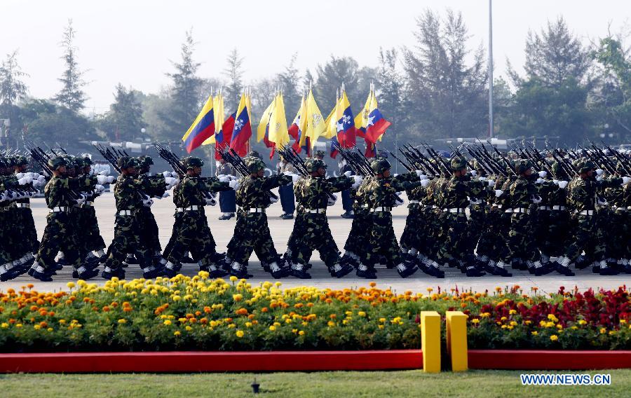 The military march is held during the parade of Armed Forces Day in Nay Pyi Taw, Myanmar, March 27, 2013. A 6,300-strong-military parade was held in Nay Pyi Taw to mark the armed forces' 68th anniversary. (Xinhua/U Aung) 