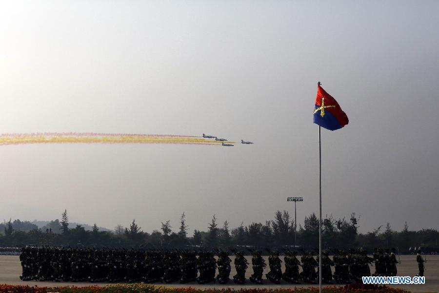Fighter jets fly over the sky during the parade of Armed Forces Day in Nay Pyi Taw, Myanmar, March 27, 2013. A 6,300-strong-military parade was held in Nay Pyi Taw to mark the armed forces' 68th anniversary. (Xinhua/U Aung) 