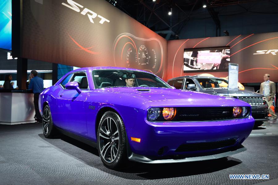 A Chrysler Challenger SRT Core coupe is on display during press preview of the 2013 New York International Auto Show in New York, on March 27, 2013. The show features about 1,000 vehicles and will open to the public from March 29 to April 7. (Xinhua/Niu Xiaolei)  