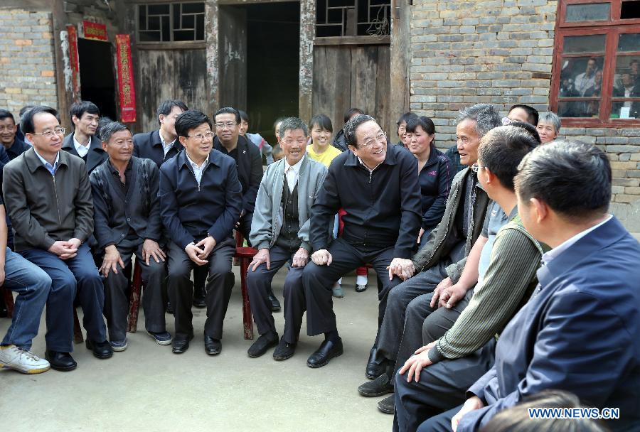Yu Zhengsheng, a member of the Standing Committee of the Political Bureau of the Communist Party of China (CPC) Central Committee, who is also chairman of the National Committee of the Chinese People's Political Consultative Conference (CPPCC), talks to villagers in Yila Village in Dafang County, southwest China's Guizhou Province, March 25, 2013. Yu was on an inspection tour in Guizhou from March 24 to March 27. (Xinhua/Yao Dawei) 