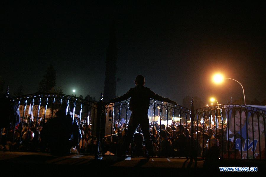 Thousands of Cypriots demonstrate to protest against the harsh treatment imposed on Cyprus by the Eurogroup, in the streets of Nicosia, Cyprus on March 27, 2013. The Mediterranean island and the Troika struck a 10 billion euro bailout deal in Brussels on March 25. The new agreement requires radical reshaping of the Cypriot banking system and massive "haircuts" on Cypriots who have more than 100,000 Euros deposited in banks. Many bank employees may lose their jobs. (Xinhua/Marios Lolos) 