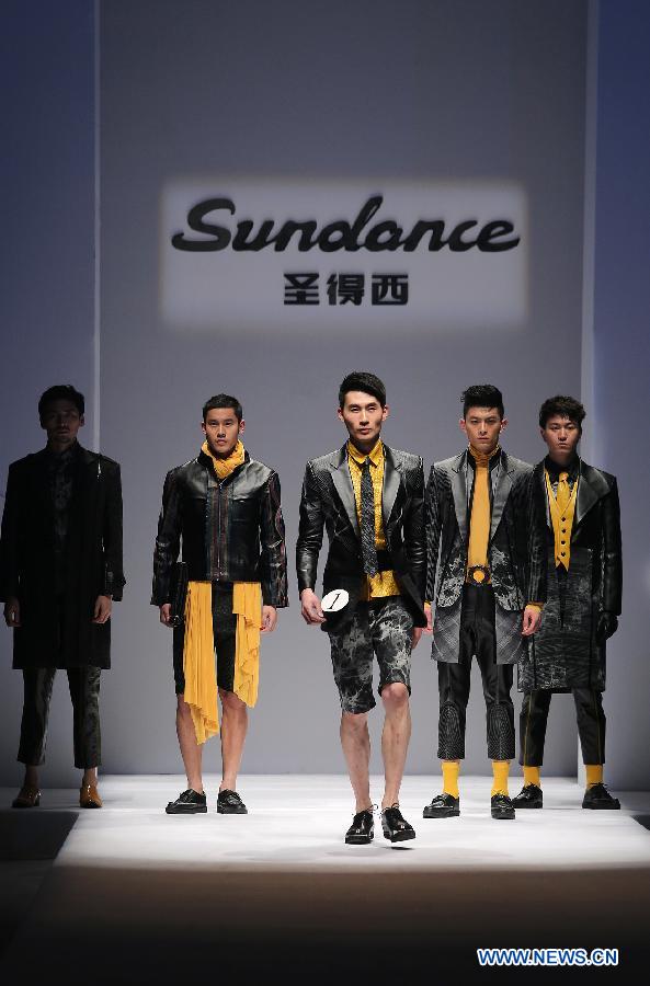 Models present creations during the 2013 "Sundance Cup" China Fashion Business Men's Clothing Design Competition in Beijing, capital of China, March 27, 2013. A total of 600 creations participated in the competition held in Beijing on Thursday. (Xinhua/Wan Xiang)