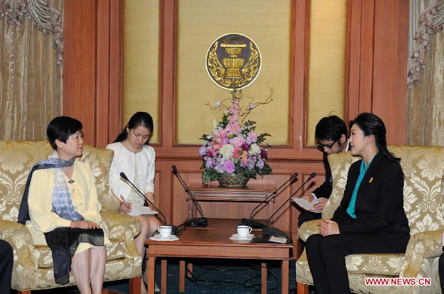 Thai Prime Minister Yingluck Shinawatra (front R) meets with Li Xiaolin (front L), President of the Chinese People's Association For Friendship With Foreign Countries, at Government House in Bangkok, Thailand, March 28, 2013. (Xinhua/Rachen Sageamsak)