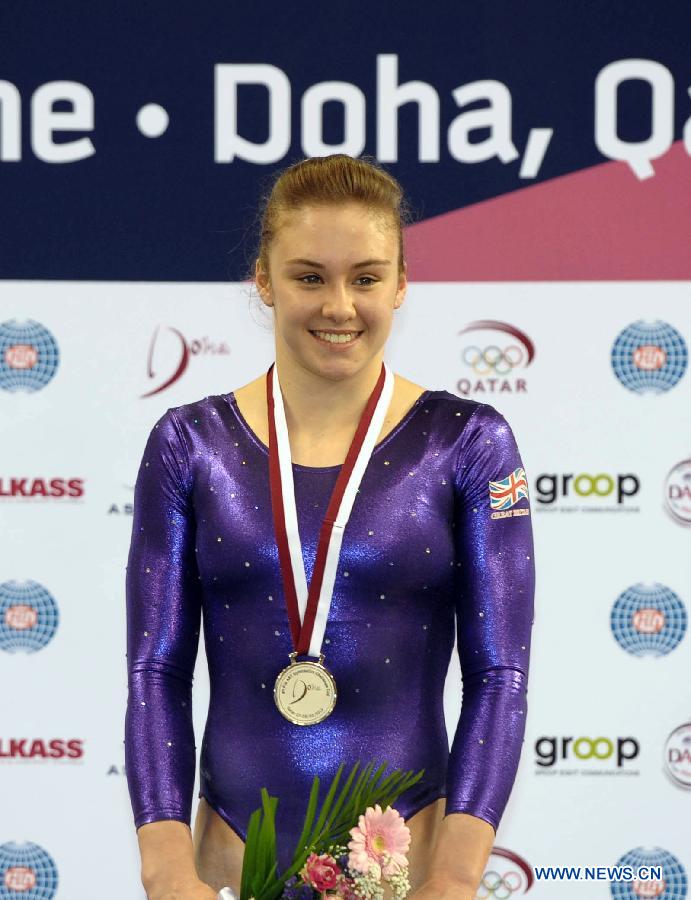 Ruby Harrold of Britain reacts during the awarding ceremony for the uneven bars at the 6th FIG Artistic Gymnastics world Challenge Cup in Doha, Qatar, March 28, 2013. Harrold took the silver medal with 14.500 points. (Xinhua/Chen Shaojin) 