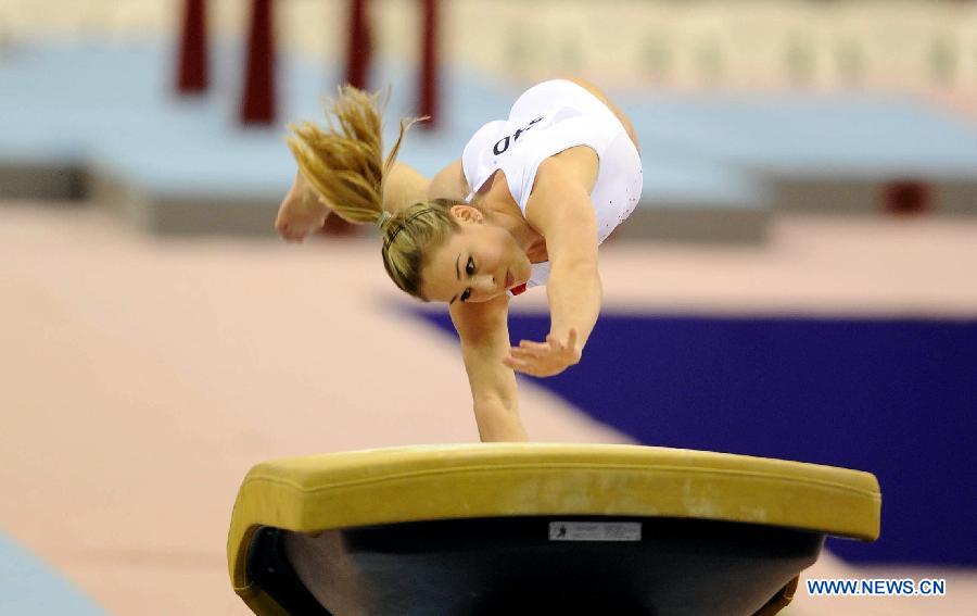 Giulia Steingruber of Switzerland competes during the women's vault final at the 6th FIG Artistic Gymnastics world Challenge Cup in Doha, Qatar, March 28, 2013. Steingruber took the bronze medal with 14.662 points. (Xinhua/Chen Shaojin)