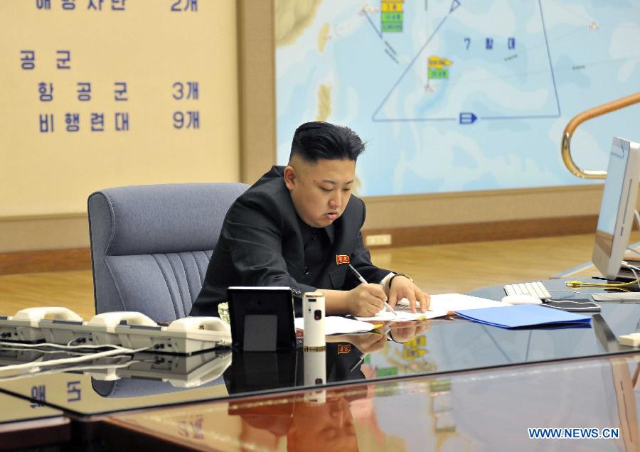 Photo released by KCNA news agency on March 29, 2013 shows top leader of the Democratic People's Republic of Korea (DPRK) Kim Jong Un attending an urgent meeting. Kim Jong Un has ratified a strike plan by the Strategic Rocket Force as U.S. B-2 stealth bombers flew over the Korean Peninsula, the KCNA news agency reported Friday. (Xinhua/KCNA)