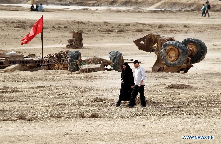 Iranians visit Talaeiyeh, a battlefield of the 1980-1988 Iran-Iraq war, in Iran's southwestern province of Khuzestan, during the Iranian New Year holidays on March 29, 2013. (Xinhua/Ahmad Halabisaz) 