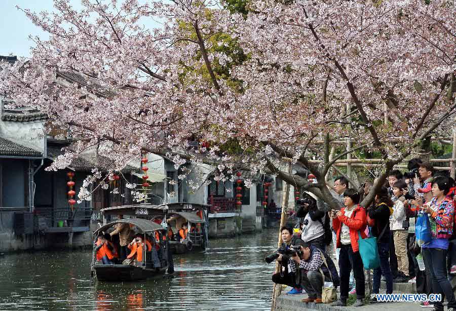 Visitors tour in the Xitang Township of Jiaxing City in east China's Zhejiang Province, March 30, 2013. Xitang, a township which enjoys thousand years' history, embraced large numbers of visitors recently. (Xinhua/Wang Song)
