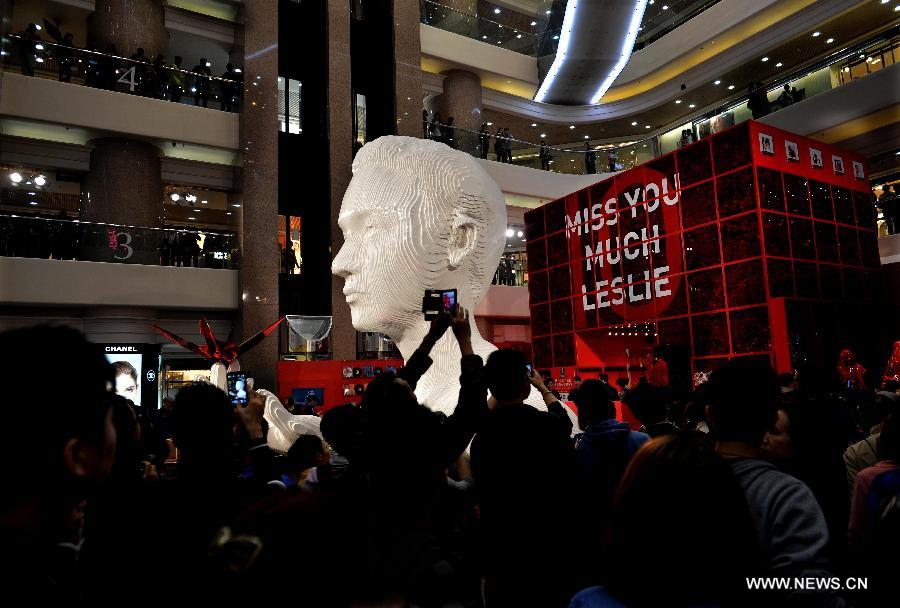 A five-metre-high sculpture of late Hong Kong singer Leslie Cheung is seen displayed at an exhibition for paying tribute to Cheung in Hong Kong, south China, March 30, 2013. The exhibition is held to mark the 10th anniversary of the death of Leslie Cheung, who leapt to his death from a hotel in Hong Kong on April 1, 2003. A total of 1,900,119 origami cranes, folded by fans around the world, are displayed inside a giant red cube, which broke the Guinness World Record as "the largest display of origami cranes". (Xinhua/Chen Xiaowei)