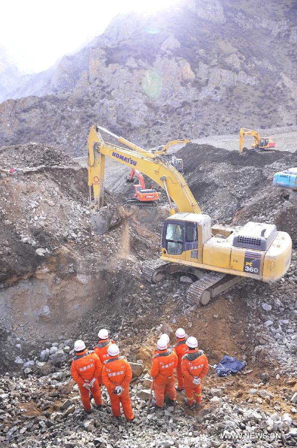 Rescuers work at the accident site in Maizhokunggar County of Lhasa, southwest China's Tibet Autonomous Region, March 31, 2013. Thirteen bodies have been found until 6:30 p.m. Sunday at the site of a mining area landslide. The disaster struck a workers' camp of the Jiama Copper Polymetallic Mine at about 6 a.m. on Friday, burying 83 workers. (Xinhua/Liu Kun)