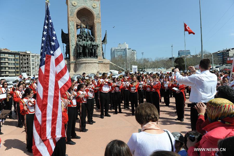 Members of the Shaker Heights High School Band perform at Taksim square in Istanbul, Turkey, March 31, 2013. The band, having 201 student players, has started a nine-day tour from March 27, stopping in six cities including Istanbul, Troy and Ephesus. (Xinhua/Lu Zhe)  