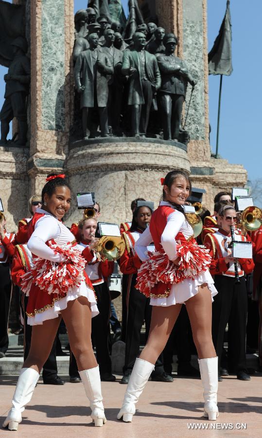 Dancers of the Shaker Heights High School Band perform at Taksim square in Istanbul, Turkey, March 31, 2013. The band, having 201 student players, has started a nine-day tour from March 27, stopping in six cities including Istanbul, Troy and Ephesus. (Xinhua/Lu Zhe) 