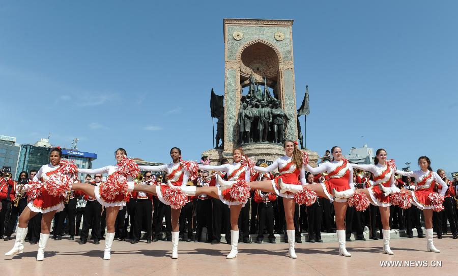 Dancers of the Shaker Heights High School Band perform at Taksim square in Istanbul, Turkey, March 31, 2013. The band, having 201 student players, has started a nine-day tour from March 27, stopping in six cities including Istanbul, Troy and Ephesus. (Xinhua/Lu Zhe) 