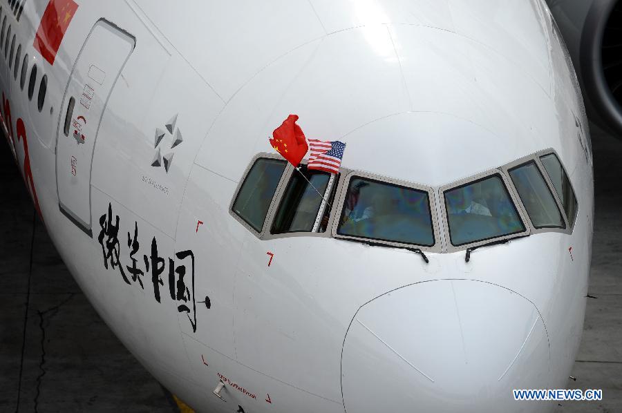 A Boeing 777-300ER flying from Beijing arrives at the John F. Kennedy International Airport in New York, March 31, 2013. Air China launched its second direct flight between Beijing and New York on Sunday, marking the company's biggest expansion in the U.S. There will be 11 flights plying between Beijing and New York each week and all of them are new Boeing 777-300ERs. (Xinhua/Wang Lei)  