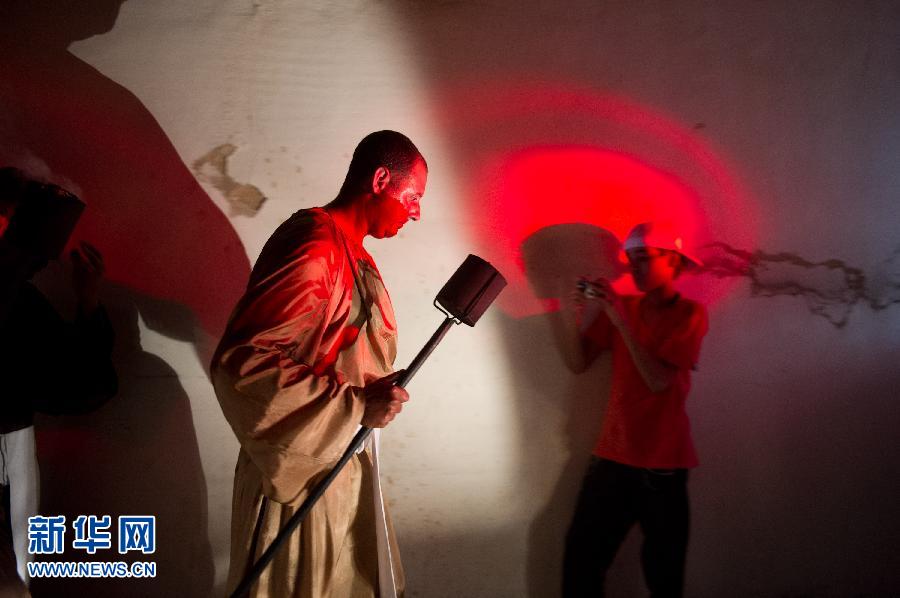 A man walks through a street after participating in a torchlight parade in Goiás, Brazil on March 28. The torchlight parade, brought to Brazil in the 18th century by colonists, is held every year in Goiás. (Xinhua/Weng Xinyang) 