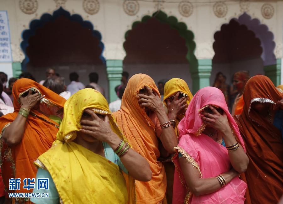 Women participate in a special game held on the first day after the Holi Festival in Mathura of India on March 28. (Xinhua/Reuters)